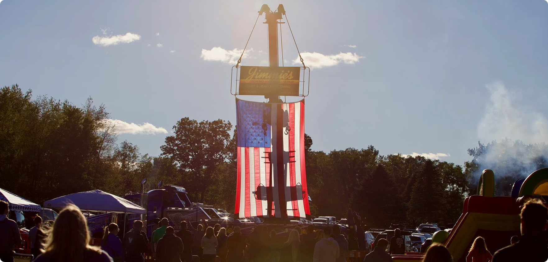 Title Partner in Charity, Jimmie's Towing, displaying the American flag.